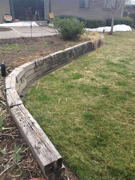 remove railroad ties with skid steer|old railroad ties wall.